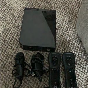 Wii console with romotes and nunchucks